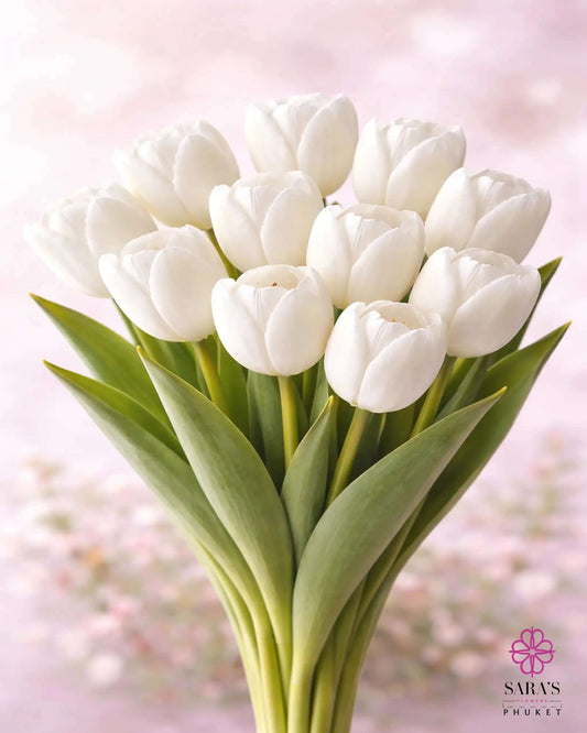 Elegant bouquet of premium white tulips with green stems, against a soft pink background.