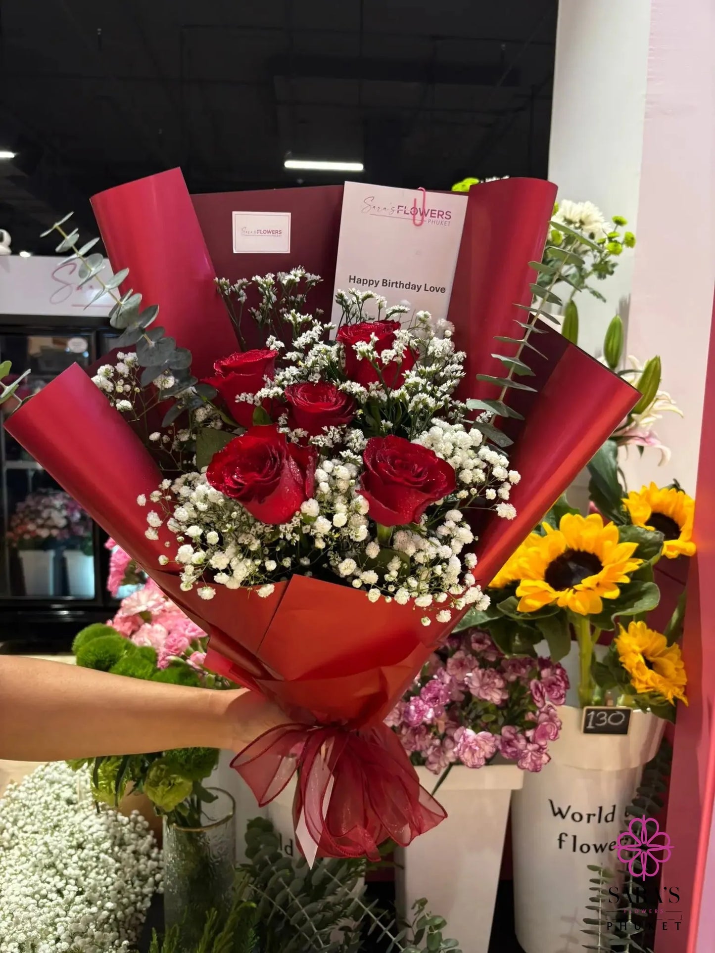 Romantic red rose bouquet with elegant layered wrapping at Sara’s Flowers Phuket