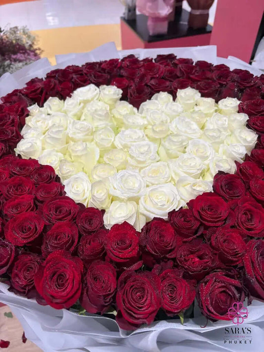 Luxury 150 rose heart bouquet with red and white roses by Sara’s Flowers Phuket. Same Day Delivery