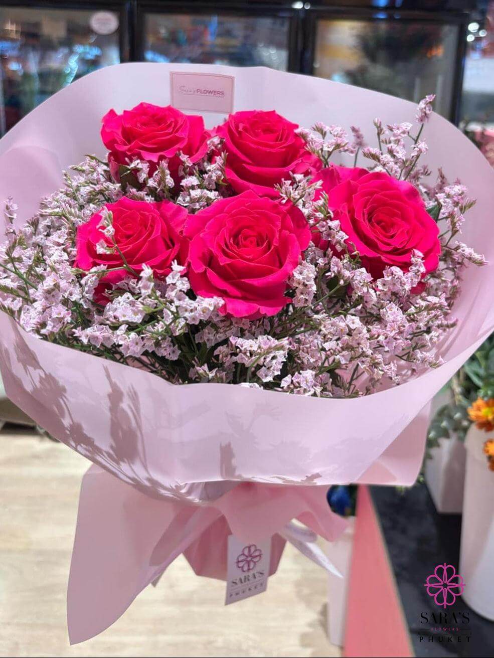 Five premium pink roses bouquet with baby's breath and blush wrapping by Sara's Flowers Phuket