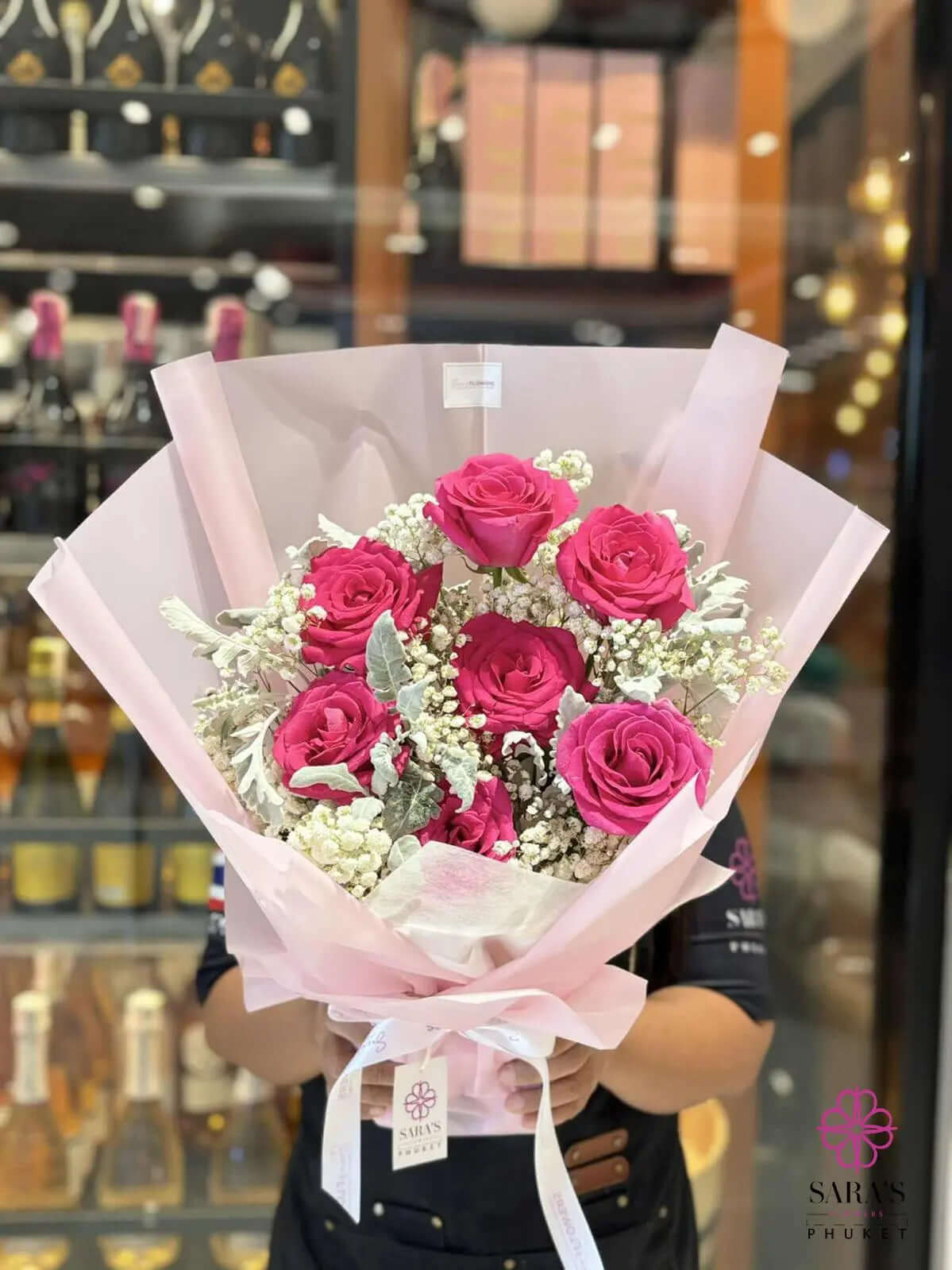 Seven deep pink roses bouquet with baby’s breath by Sara’s Flowers Phuket