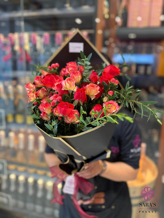 Orange & red roses in elegant luxury wrapping