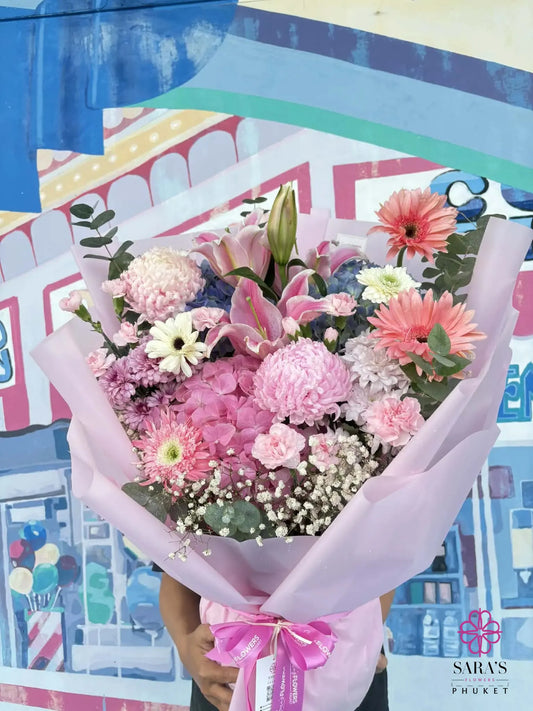 Soft pink garden style flower bouquet with premium wrapping and satin ribbon in Phuket