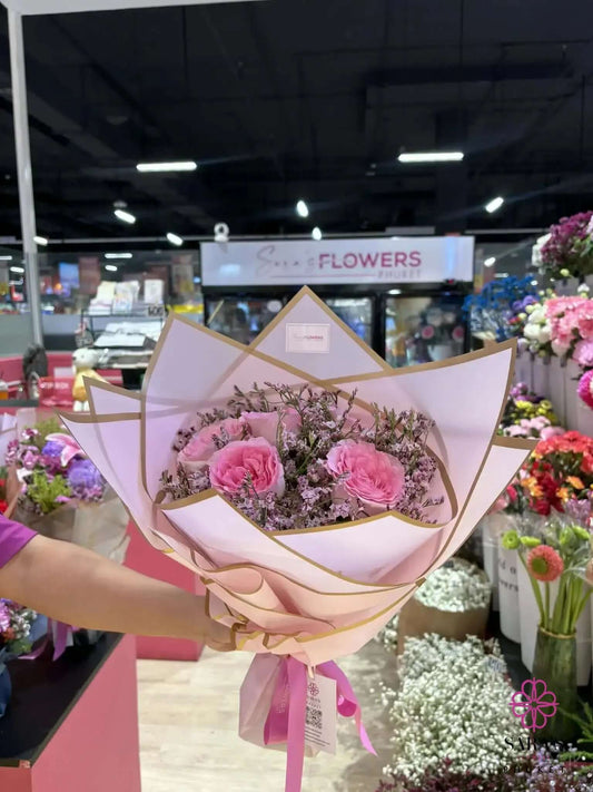 Petite pink rose bouquet with gold-edged wrapping and satin ribbon in Phuket