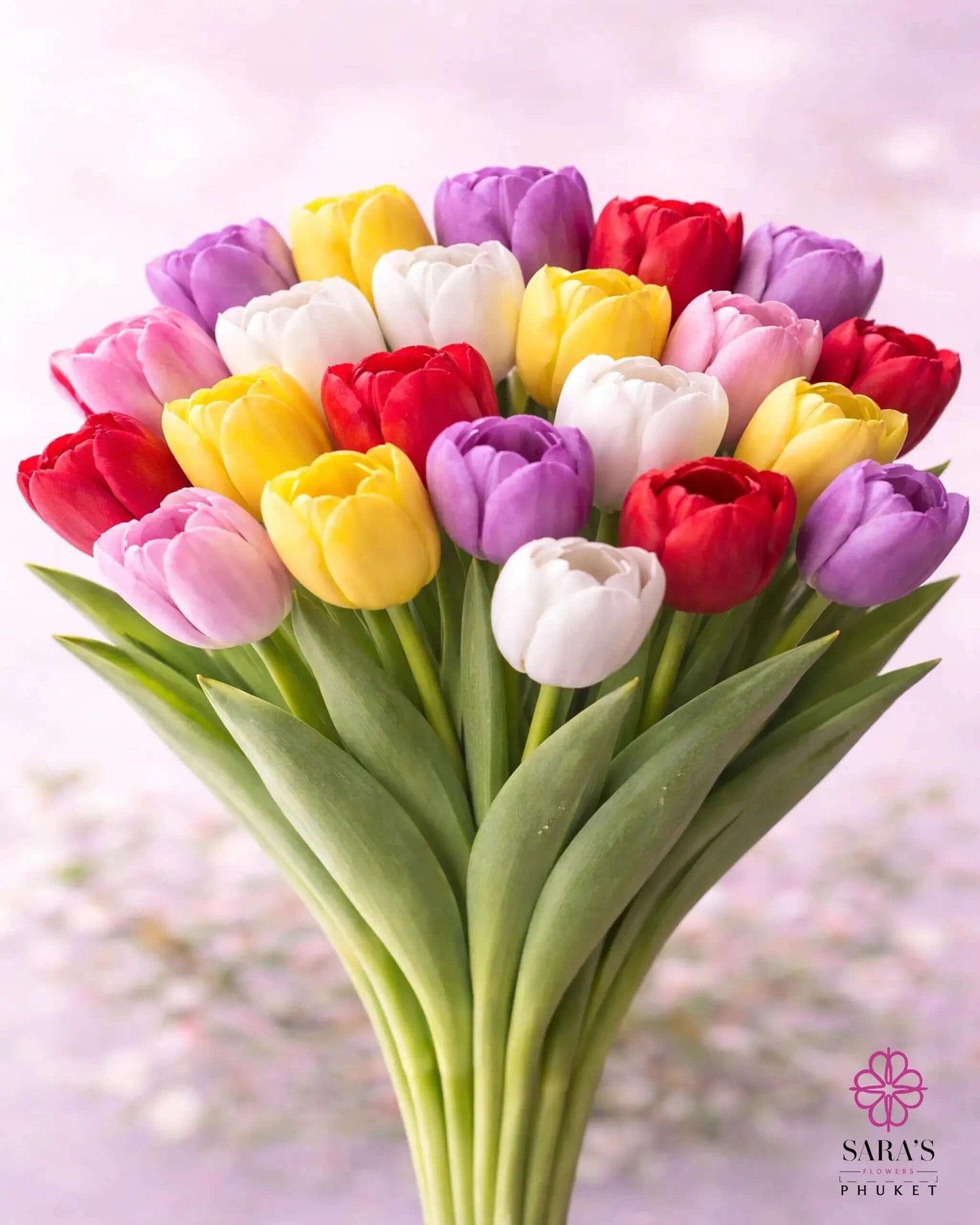Vibrant Sara's Signature Tulip Bouquet with assorted red, pink, yellow, purple, and white premium tulips.