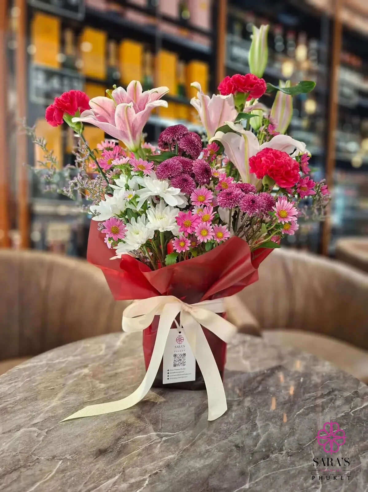 Bright pink lily bouquet with carnations chrysanthemums and premium wrapping by Sara’s Flowers Phuket