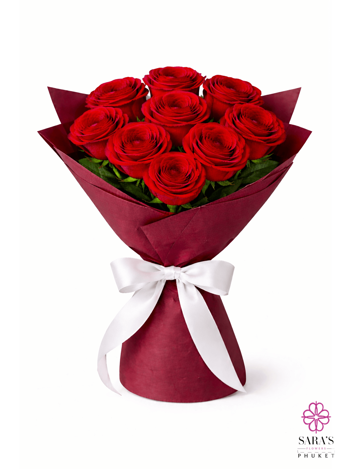 Luxury red rose bouquet with elegant maroon wrapping and a white satin bow by Sara’s Flowers Phuket.