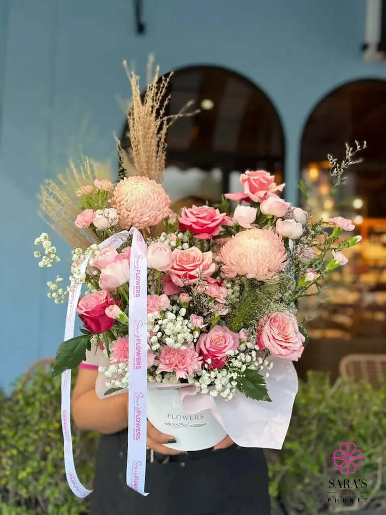 Elegant pink flower basket with roses lilies and seasonal blooms in Phuket