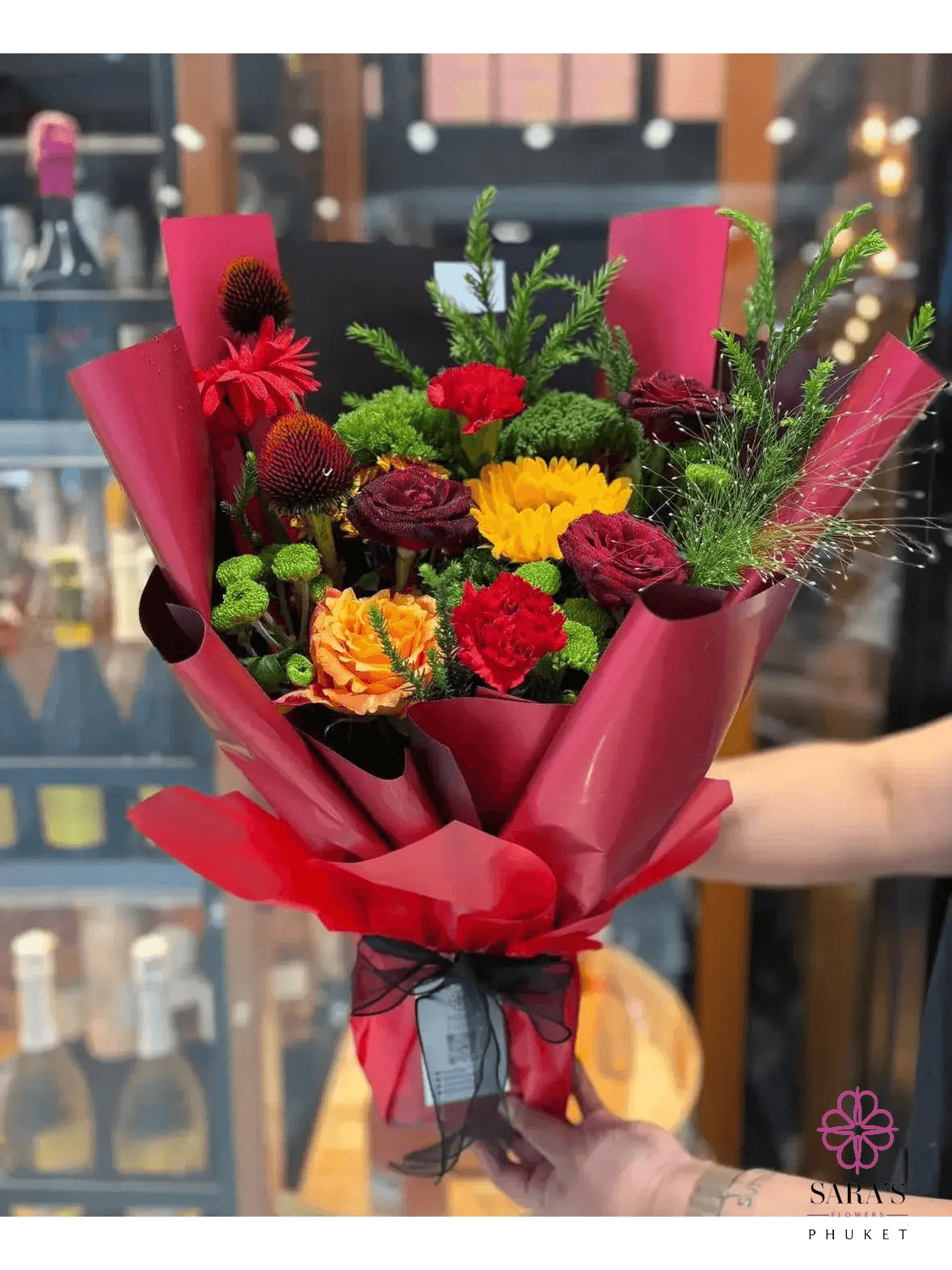 Bold red and yellow flower bouquet with roses for same day delivery in Phuket