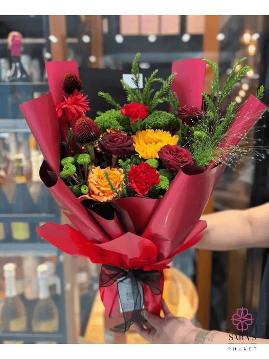 Bold red and yellow flower bouquet with roses for same day delivery in Phuket