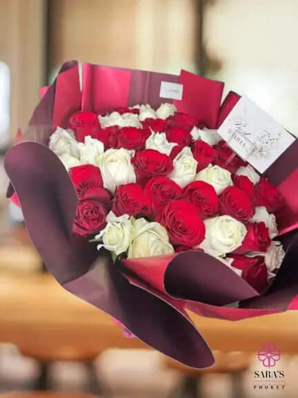 Luxury bouquet of 50 red and white roses with elegant wrapping by Sara’s Flowers Phuket