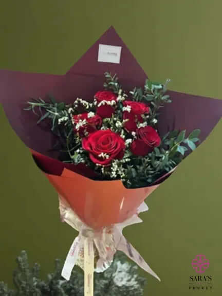 Red rose bouquet with fresh greenery and elegant wrapping by Sara’s Flowers Phuket