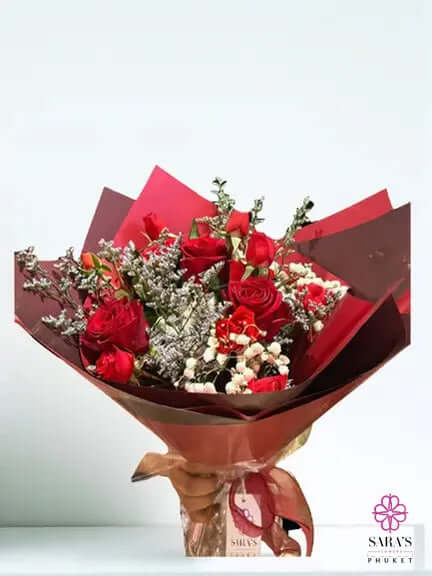 Romantic red rose bouquet with luxury burgundy wrapping by Sara’s Flowers Phuket