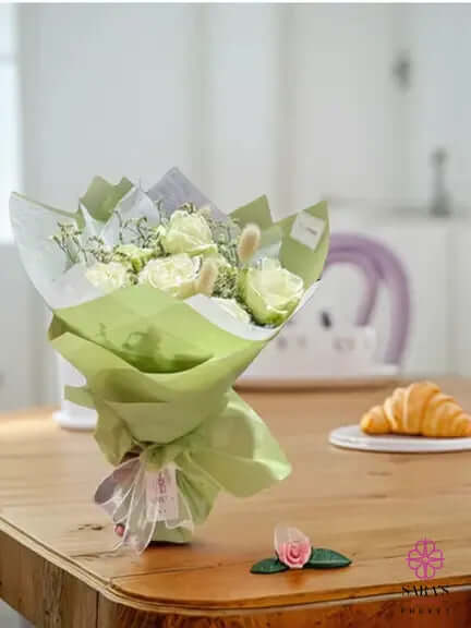 Elegant sage green and ivory rose bouquet by Sara’s Flowers Phuket