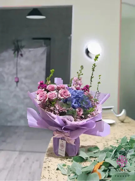 Lavender Harmony Bouquet with blue hydrangea pink roses and lavender wrapping by Sara’s Flowers Phuket