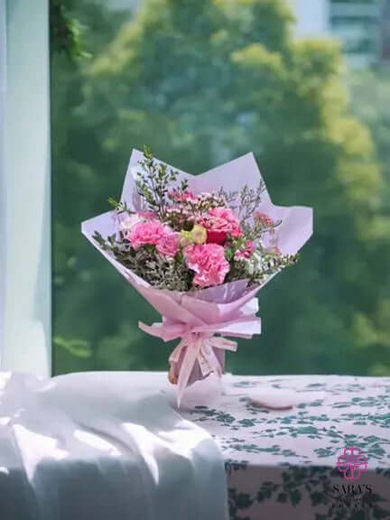 Pink Petal Poetry bouquet with pink roses carnations lavender statice and pastel wrapping by Sara’s Flowers Phuket