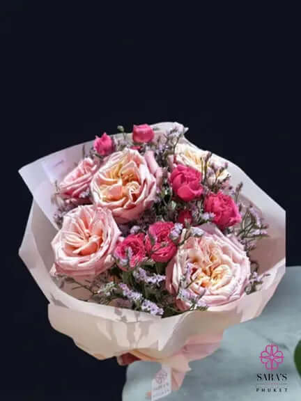 Pinks and Reds bouquet with pink roses red roses and pastel wrapping by Sara’s Flowers Phuket