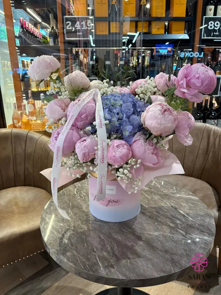 Cloud Nine Peony Hat Box with pink peonies blue hydrangea and baby’s breath in Phuket