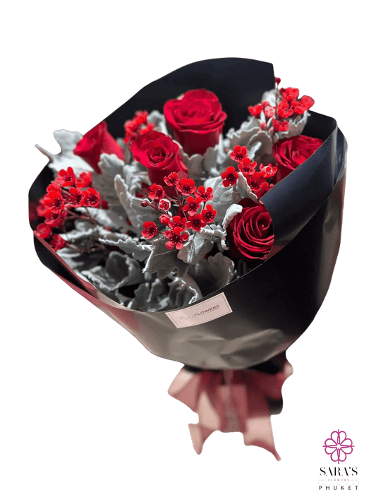 Luxury red rose bouquet with silver foliage and elegant black wrapping by Sara's Flowers Phuket