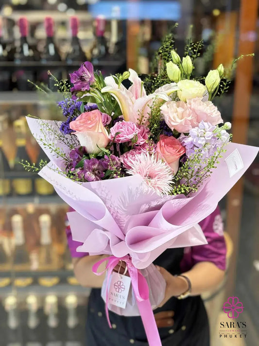 Luxury pastel bouquet with pink lilies, spray roses, and lisianthus by Sara’s Flowers Phuket