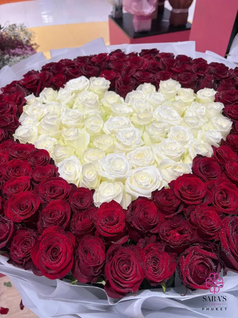 Luxury 150 rose heart bouquet with red and white roses by Sara’s Flowers Phuket. Same Day Delivery
