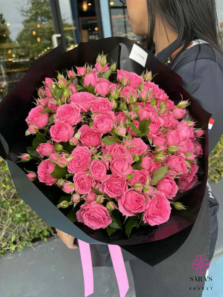 Pretty in Pink bouquet with pink spray roses and black luxury wrapping by Sara’s Flowers Phuket