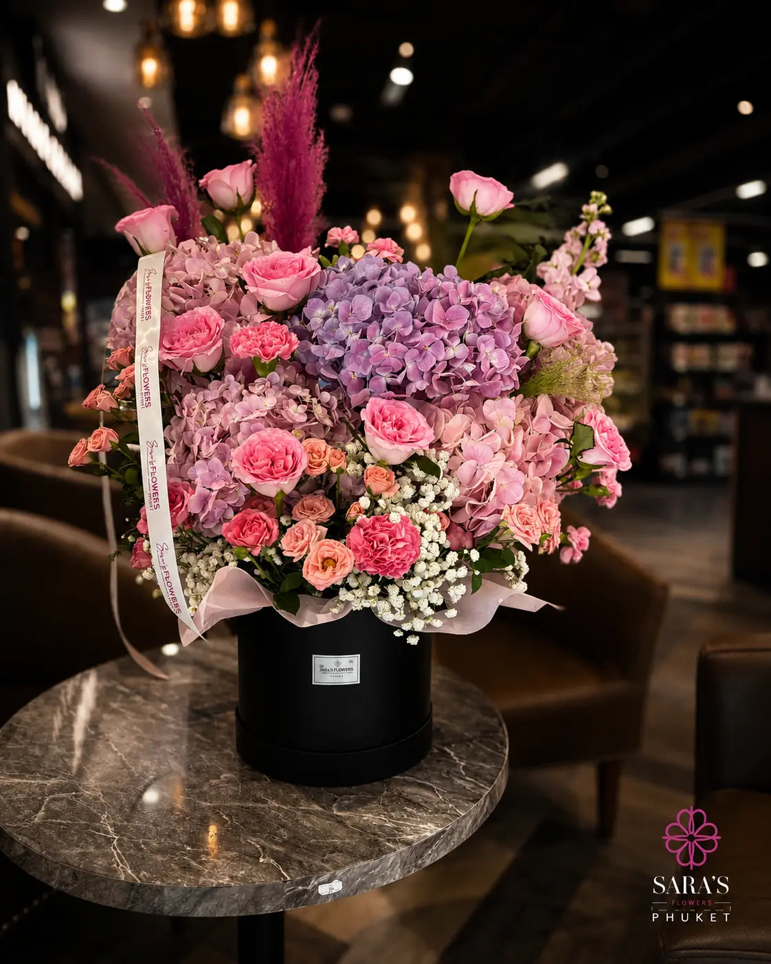 Luxury purple hydrangea hatbox arrangement with pink roses by Sara’s Flowers Phuket