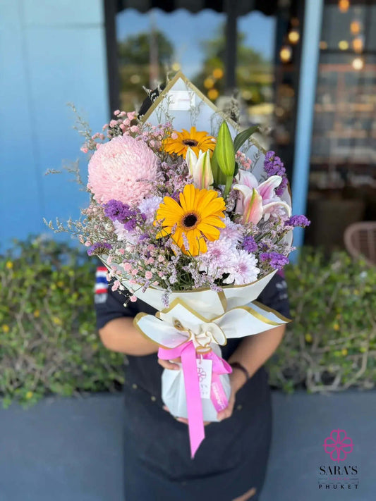 Pastel bouquet with yellow gerberas and lilies by Sara’s Flowers Phuket. Same Day Delivery