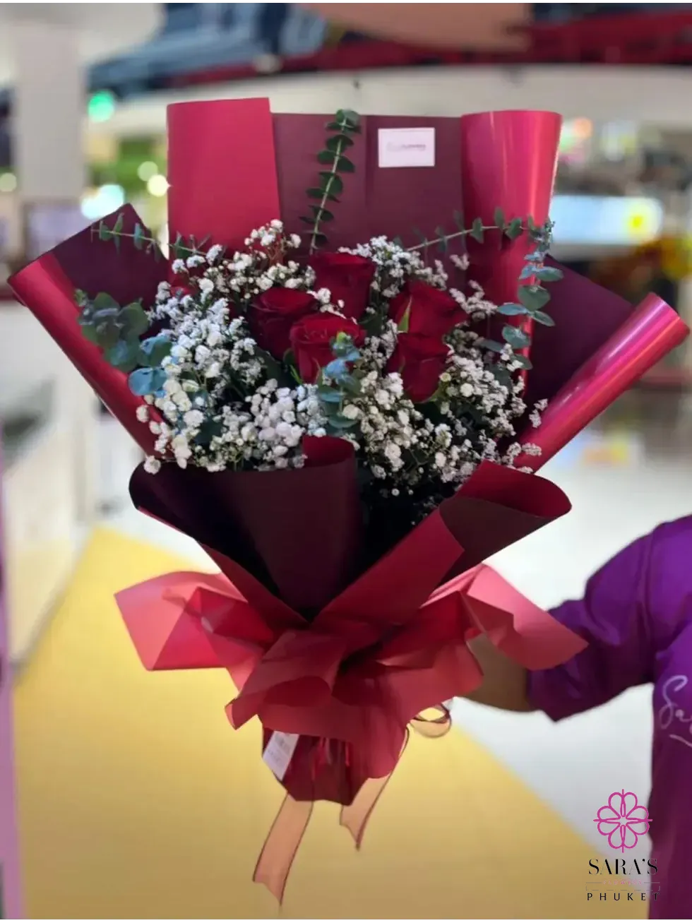 Red rose bouquet with baby’s breath in luxury black and burgundy wrapping by Sara’s Flowers Phuket