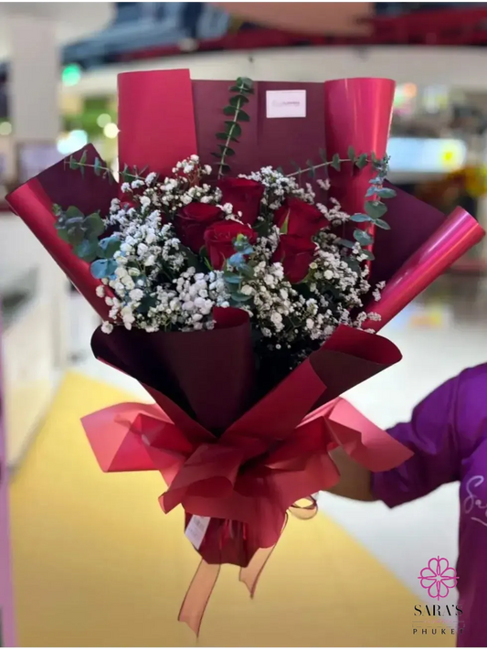 Red rose bouquet with baby’s breath in luxury black and burgundy wrapping by Sara’s Flowers Phuket