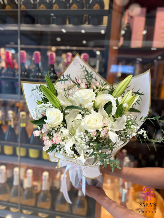 White Elegance luxury bouquet with white roses, lilies, baby's breath and premium wrapping by Sara's Flowers Phuket