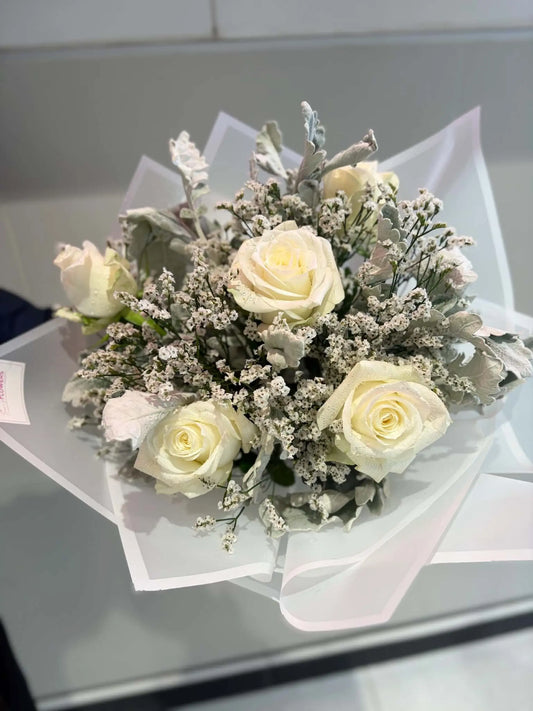 Luxury white rose bouquet with statice and silver foliage by Sara's Flowers Phuket