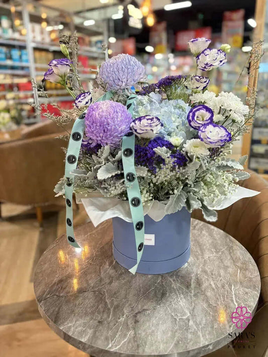 Modern blue and lavender flower hatbox arrangement in Phuket