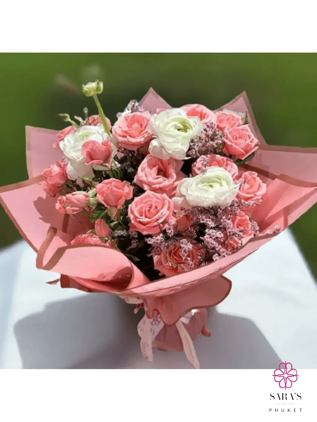 Elegant blush pink bouquet with spray roses and white ranunculus by Sara’s Flowers Phuket