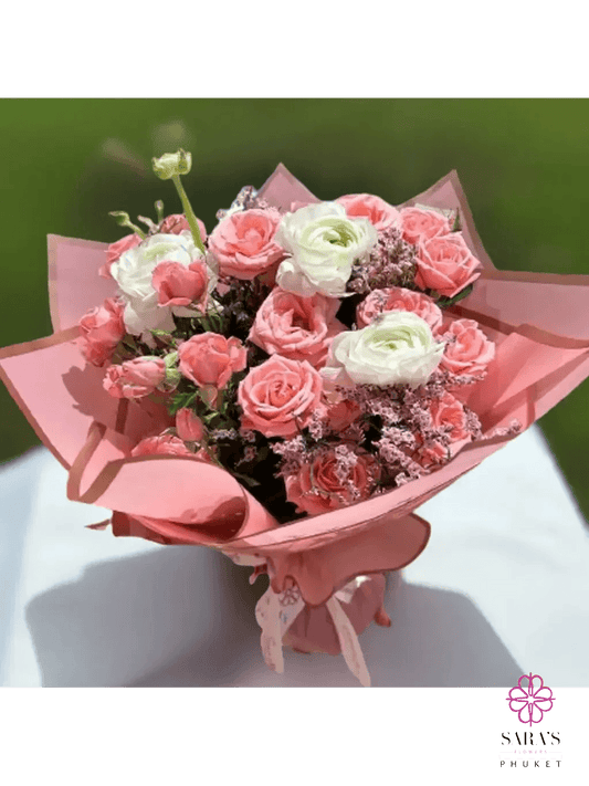 Elegant blush pink bouquet with spray roses and white ranunculus by Sara’s Flowers Phuket