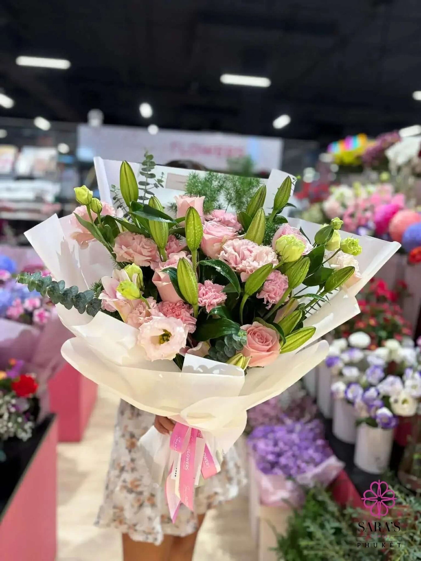 Luxury pink lily and rose bouquet with pastel flowers wrapped in elegant white paper by Sara’s Flowers Phuket