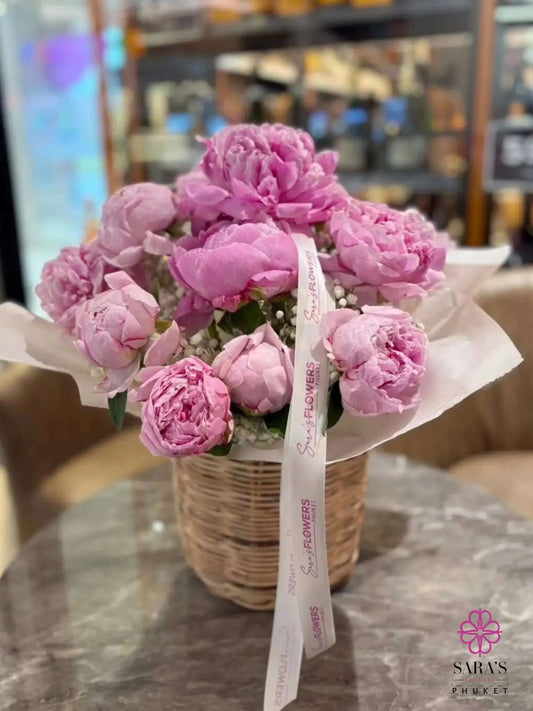 Luxury pink peony basket arrangement with pastel ribbon by Sara’s Flowers Phuket