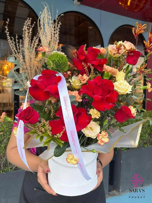 Luxury red rose and mixed flower hatbox arrangement by Sara’s Flowers Phuket